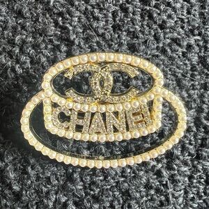 CHANEL Gold and Pearl Logo Brooch